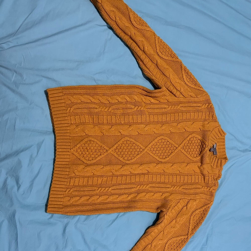 Selling a golden brown turtle neck